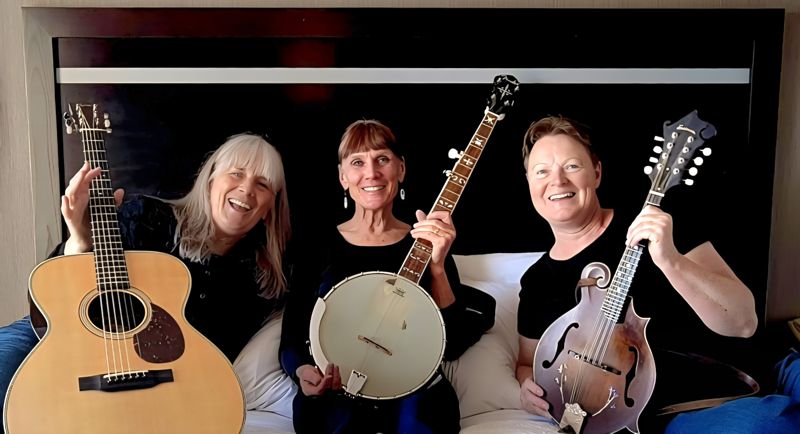 The Sweet Colleens with instruments.
